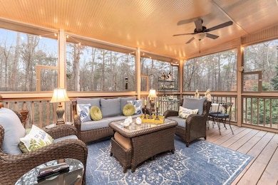 Sunroom with an outdoor hangout area, a ceiling fan, and healthy amount of natural light