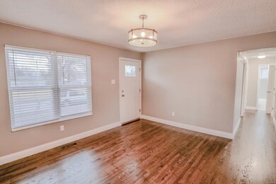 Enter to gorgeous refinished wood floors throughou