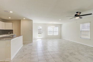 Tile floors all through the entry to the kitchen a
