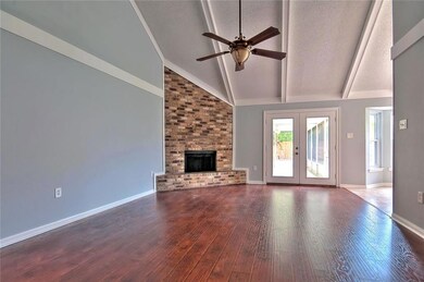 Great Room/Den with wood burning Fireplace.  Doubl
