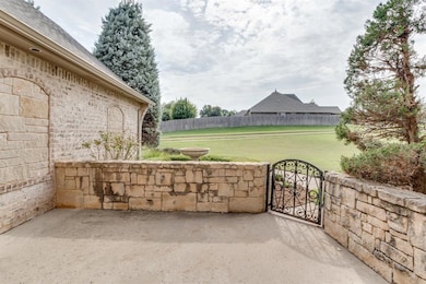 View of patio featuring a gate