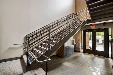 Stairs featuring a high ceiling