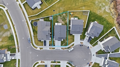 Aerial view of residential area with property boundaries highlighted