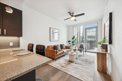 Living room with light wood-style flooring, a cei