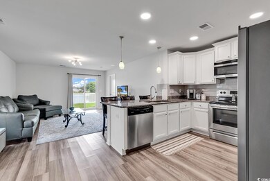 Kitchen featuring light hardwood / wood-style floo