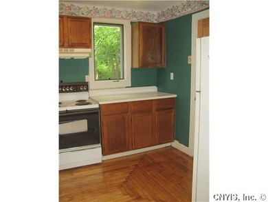 Kitchen. The newly re-finished floors extend into 