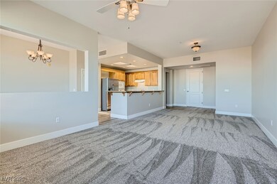  living room with new carpet, a ceiling fan, and r