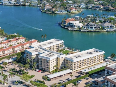 Aerial view of a large body of water and apartment complex / building