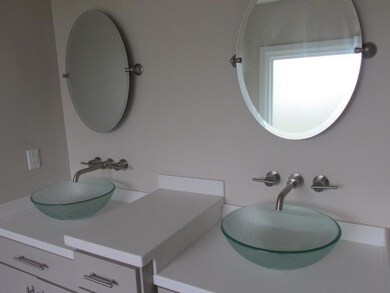 Master bath with his and her vanities, whirlpool tub and a huge, huge walk in closet.