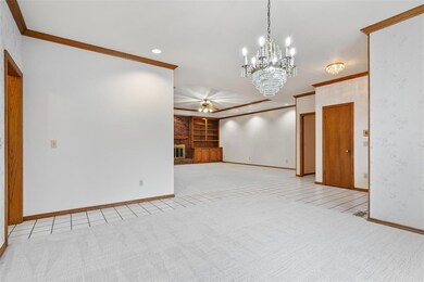 Unfurnished living room with built in features, a 