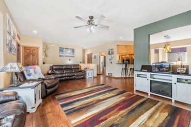Living area featuring ceiling fan, recessed lighti