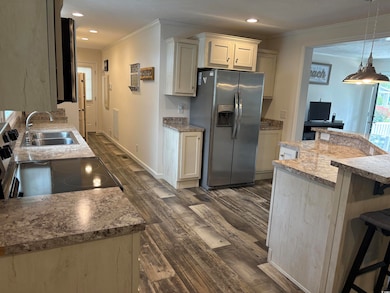 Kitchen with stainless steel fridge with ice dispe