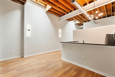 Basement with refrigerator and light wood finished
