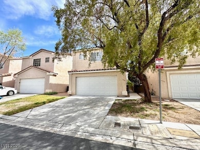 View of front of home featuring stucco siding, a t