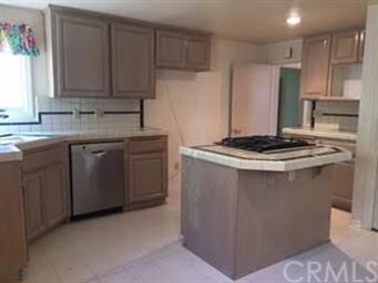 another view of kitchen with laundry hook ups