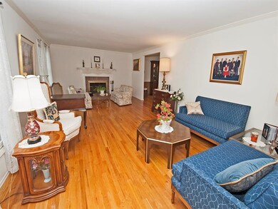 Formal living room with gas fireplace.