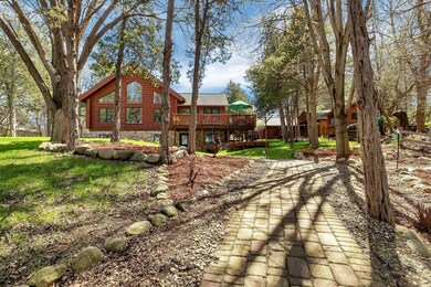 Situated on a dead end private road- Approx. 1 Acre private log home retreat on Koetter Lake- Part of the Horseshoe Chain of Lakes