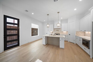 The area beneath the kitchen island features beaut