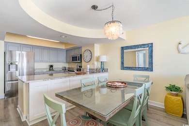 Dining room featuring an inviting chandelier, sink