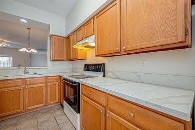 The kitchen features new Quartz countertops, tile