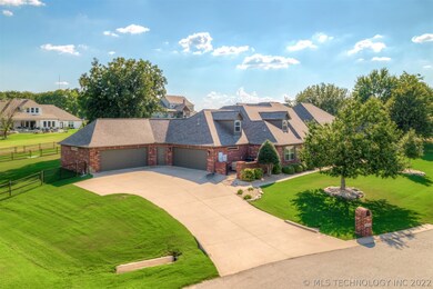 Wide driveway with four car garage