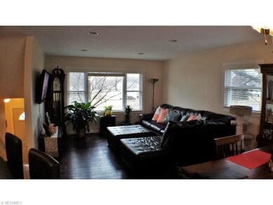 Spacious LR with can lighting and hardwood floors.