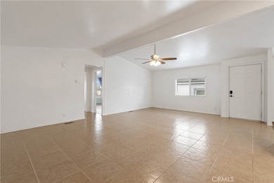 The spacious living room offers tile floors and room to spread out.