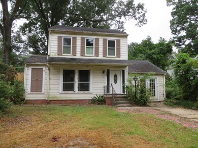 View of property featuring a front yard