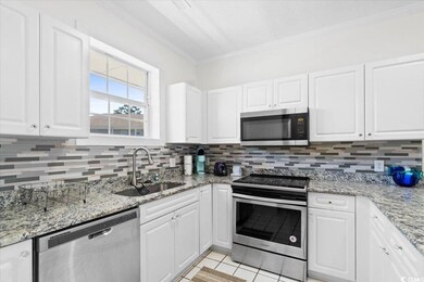 Kitchen featuring appliances with stainless steel 
