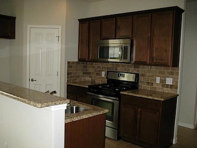 Kitchen with appliances with stainless steel fini