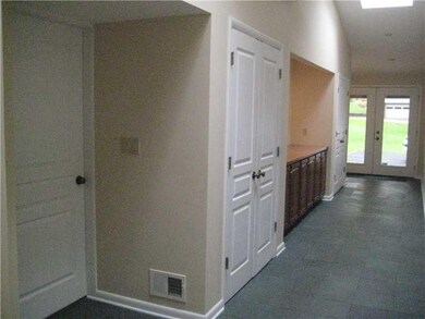 Entry/Foyer. View of additional built-ins in the s