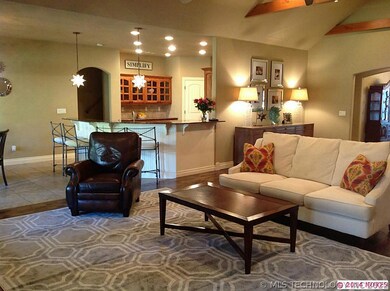 View of kitchen and breakfast bar from living