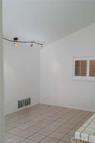 Vaulted ceiling makes bright and airy family room.