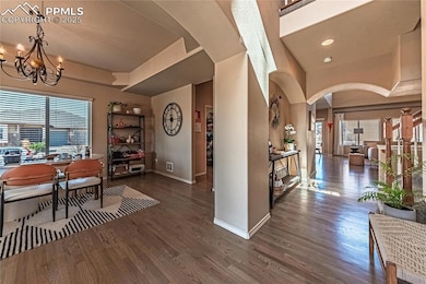 Dining space featuring wood finished floors, baseb