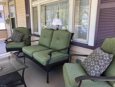 The front porch has plenty of room for furniture.