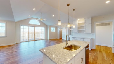 LIVING ROOM VIEW FROM DIFFERENT ANGLE FROM OPEN CONCEPT KITCHEN