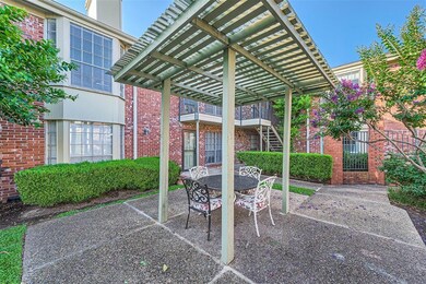 View of patio / terrace featuring a pergola and o