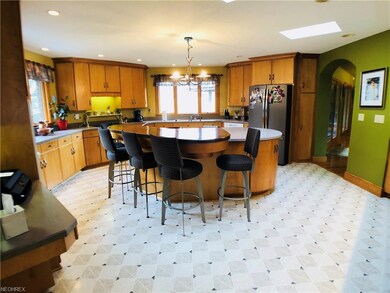 Large kitchen with Corian countertops and island w