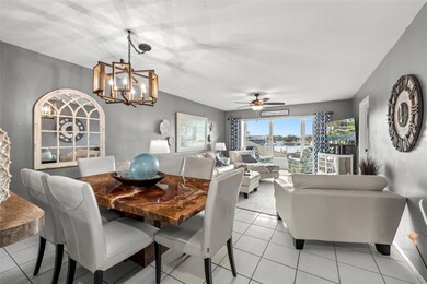 View of the dining/living room combo!  The dining room easily accommodates 6 people. Nice lighting - coastal meets farmhouse dining fixtures and decor.