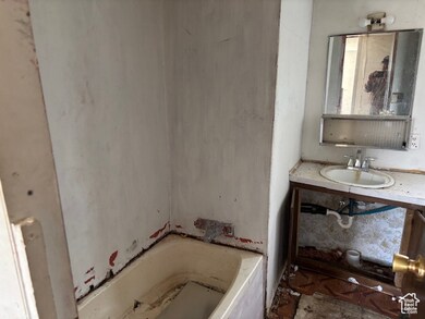 Bathroom with a bath and vanity