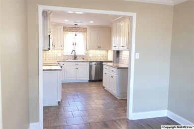 The dining room opens into the beautifully remodeled kitchen.
