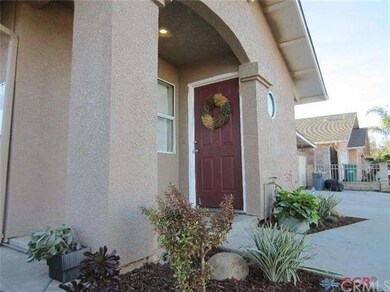 Welcoming entry with fresh landscaping