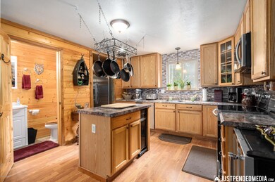 Kitchen with glass tile back splash