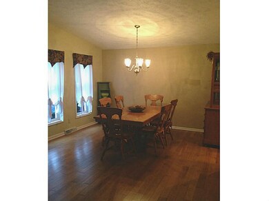 Dining Room. Hardwood flooring in dining room with vaulted ceilings.