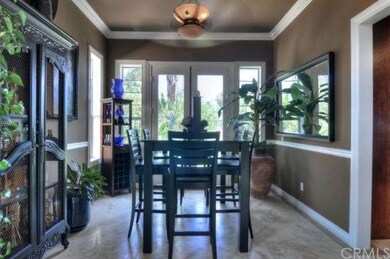 Light and bright dining room is large enough to ac