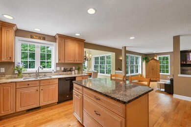 Open concept kitchen to dining to living room 1/3