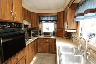 Plenty of Wood Cabinets in 15x7 Kitchen w/ Electri