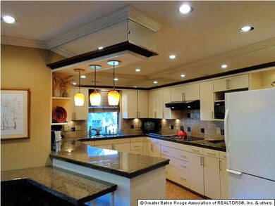 Beautiful kitchen with slab granite counter tops.