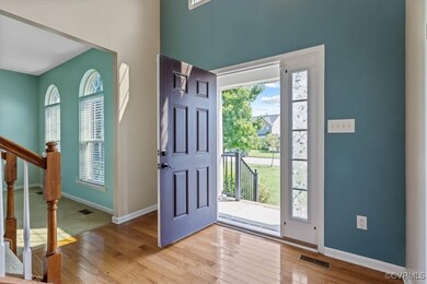 Foyer with light hardwood / wood-style flooring