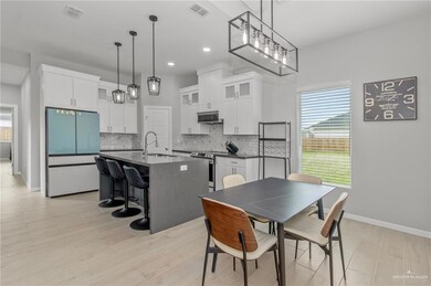 Dining room with sink and light hardwood / wood-style floors